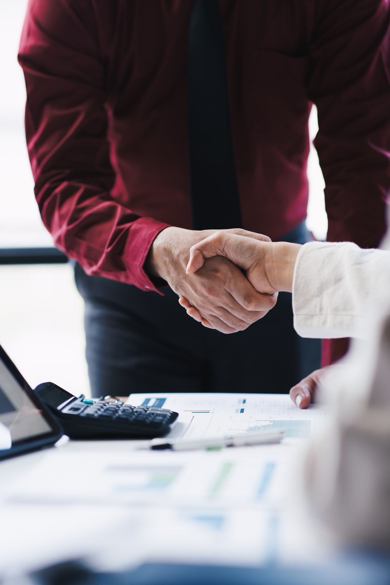 Business people having a handshake. Successful businessmen handshaking after good deal.
